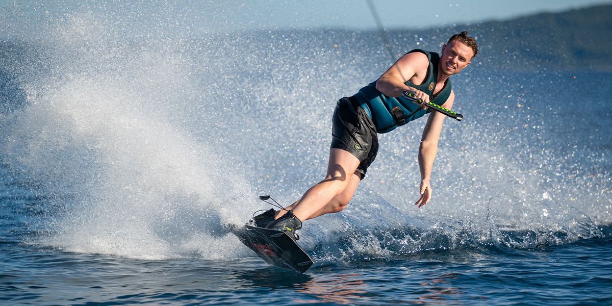 Wakeboard rider carving across the water